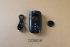 Find My-ready alarm bike tail light with wireless remote and cable arranged on an OPlace box